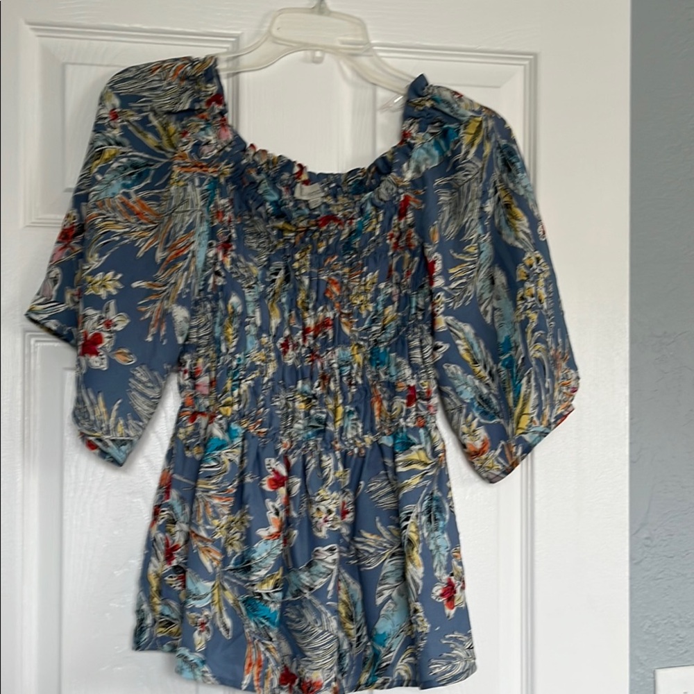 Blue Smocked Blouse with Puff Sleeves and Ruffled Details